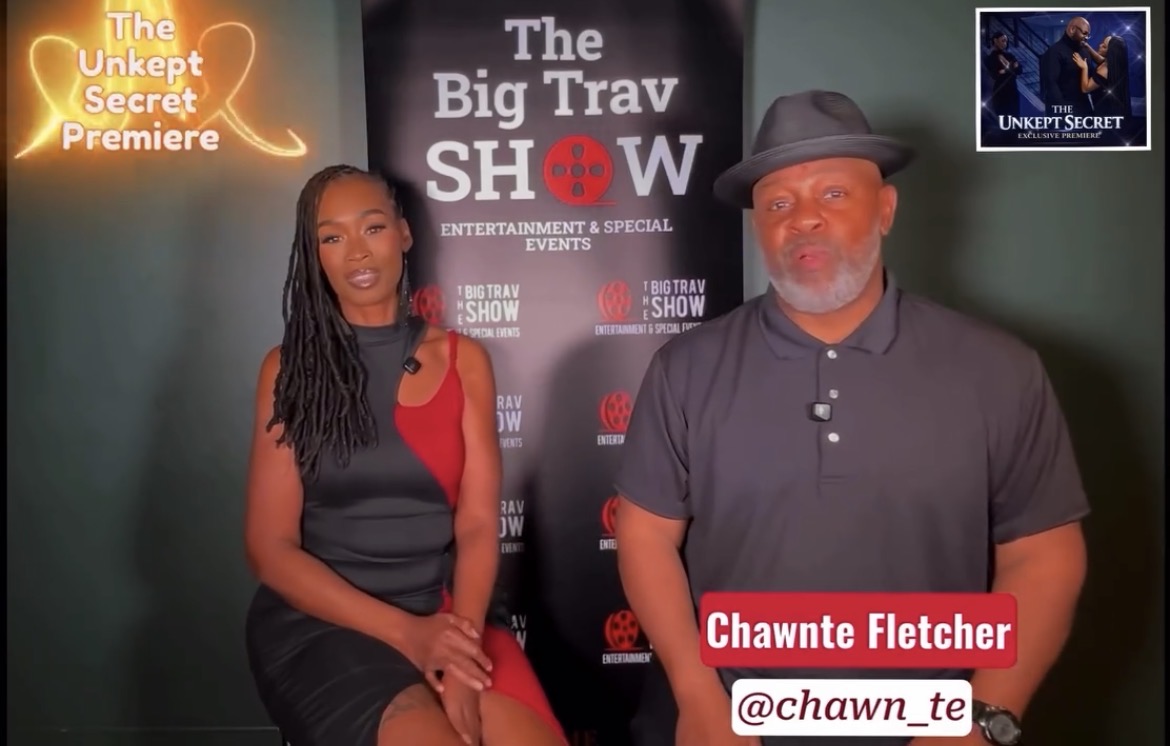 Two people sitting in front of a backdrop with event logos, one woman and one man, with a red name tag reading 'Chawne Fletcher'.