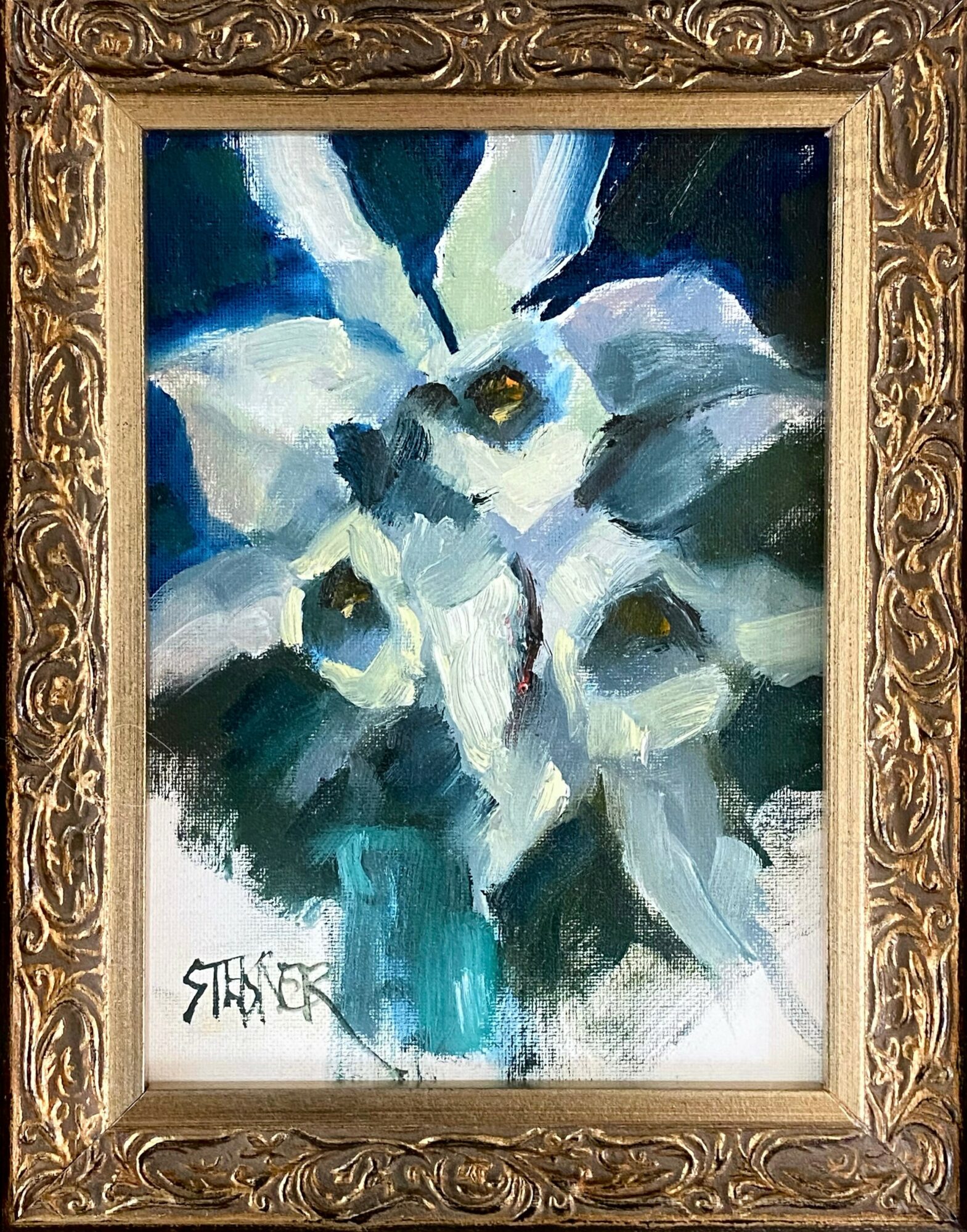 Abstract painting of white calla lilies with yellow centers, framed in ornate gold, signed in bottom left corner.