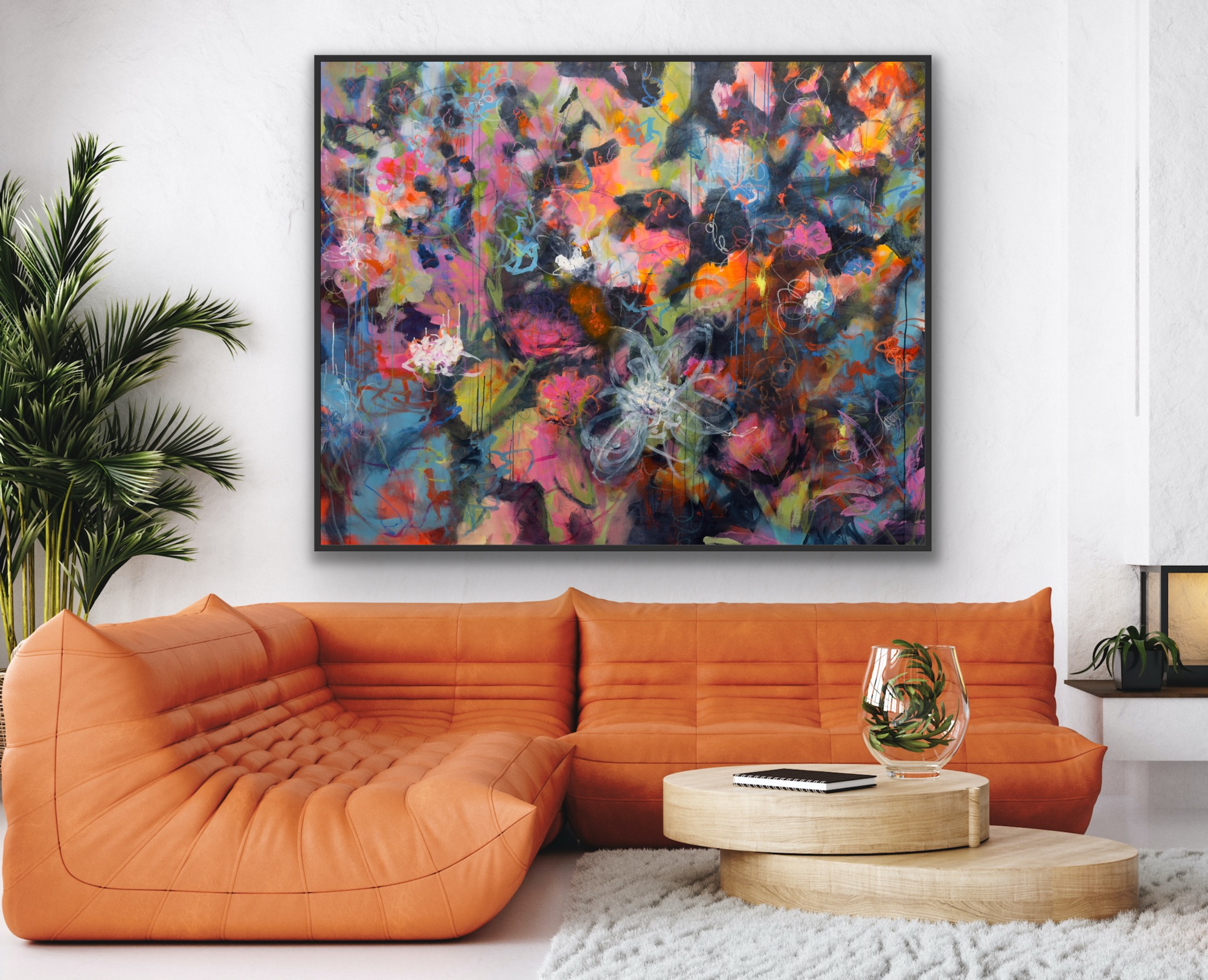 Colorful abstract painting above an orange sectional sofa in a modern living room.