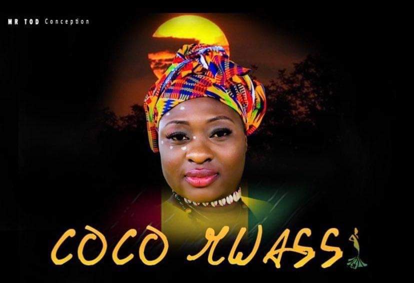 Portrait of a woman wearing a colorful headwrap, with a sunset background and text 'COCO KWASS' below.