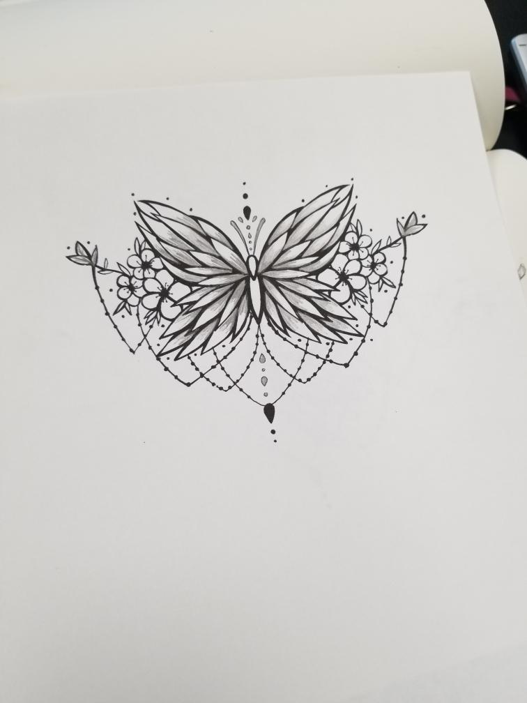 Intricate symmetrical butterfly with decorative patterns and dots, centered on a white background.
