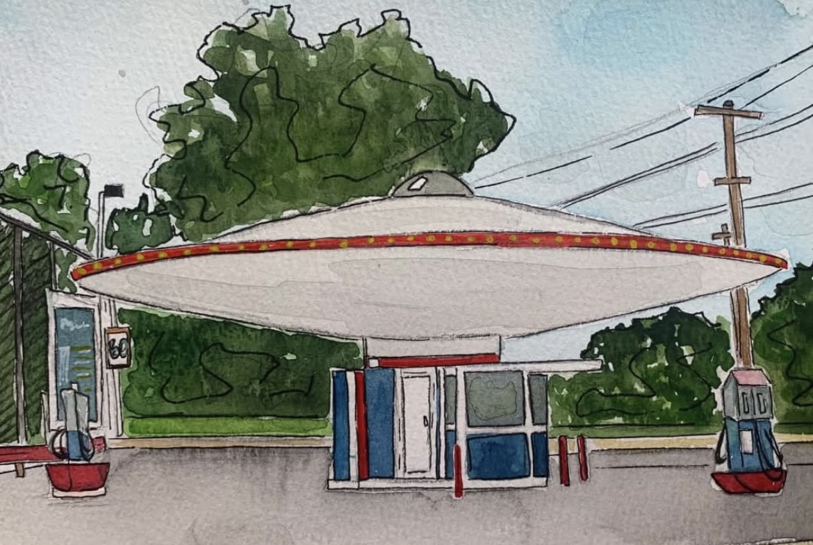 UFO-shaped structure with a large umbrella-like top, small building underneath, trees and power lines in background.