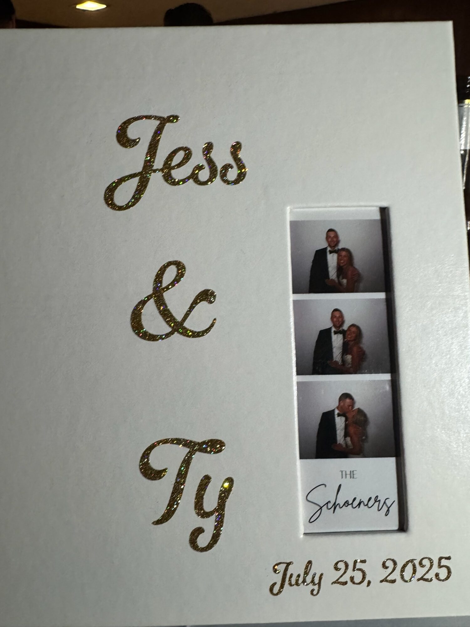 White card with gold cursive text 'Jeds & Ty' and a photo strip of three pictures, with a signature and date July 25, 2025.