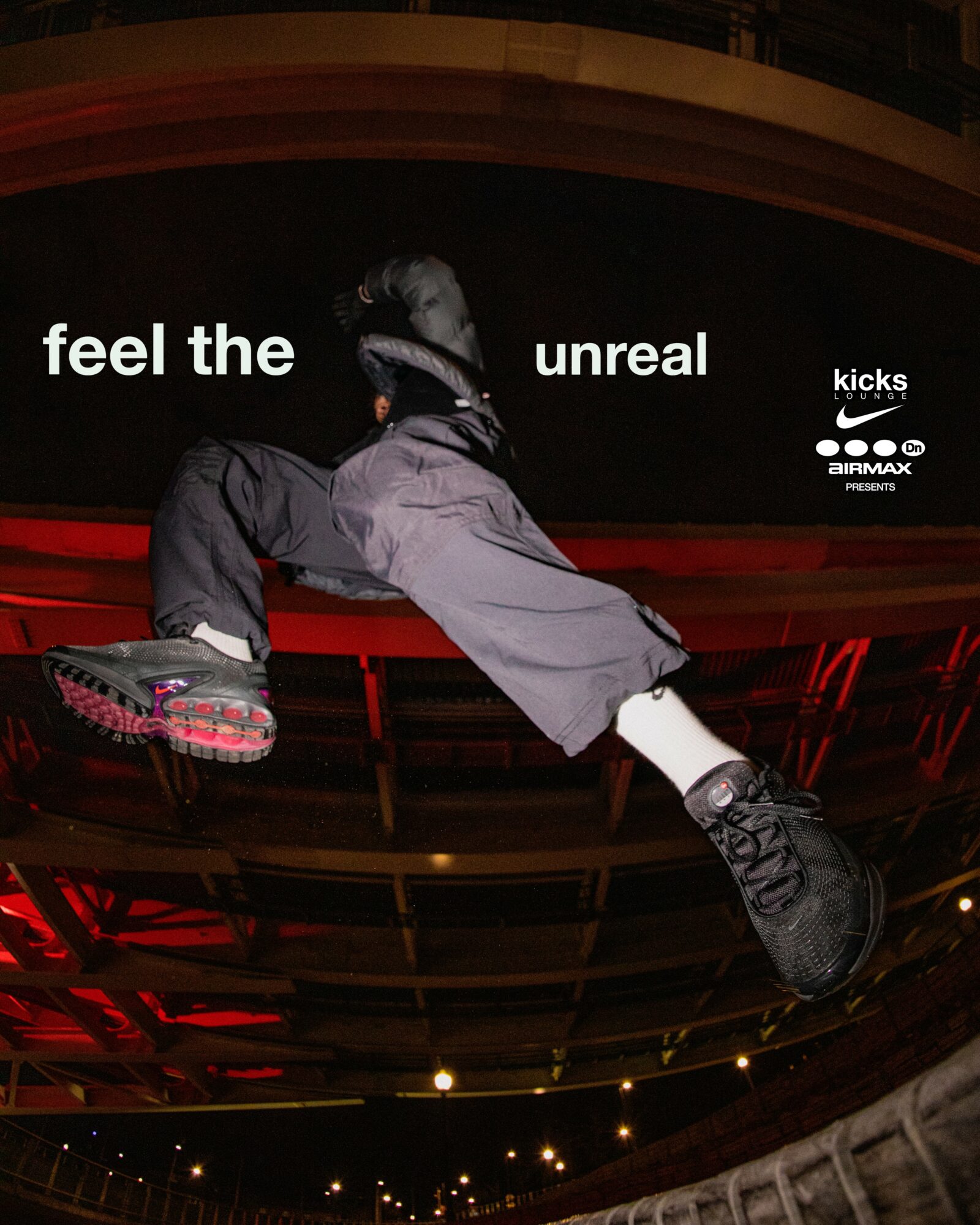 Person mid-air wearing sneakers, with text 'feel the unreal kicks' and logos, against a dark background.