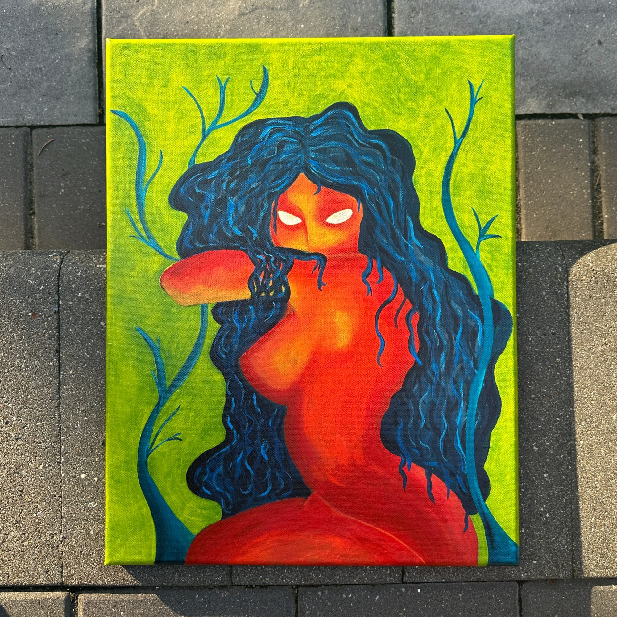 A vibrant painting of a red-skinned woman with long, flowing blue hair, surrounded by green vines, with glowing eyes.