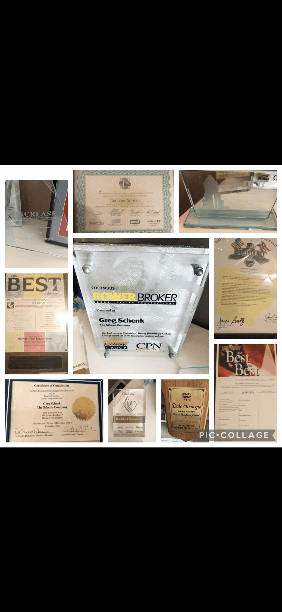 Collection of awards, certificates, and plaques displayed on various surfaces, with some items featuring text and logos.