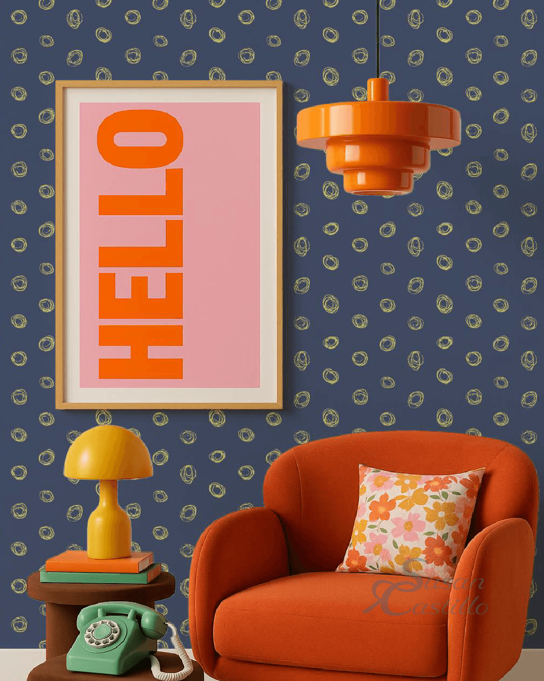 Living room with a framed sign saying HELLO, orange armchair with a floral pillow, yellow lamp, and orange ceiling light.