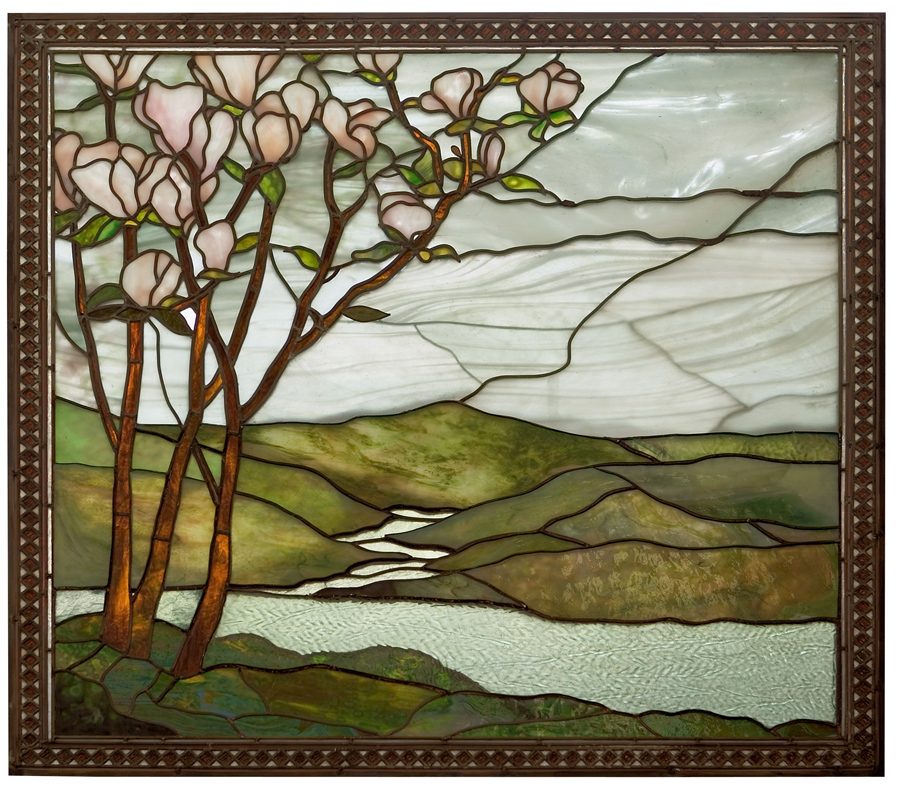 Stained glass window depicting flowering trees, rolling hills, and a river under a cloudy sky.