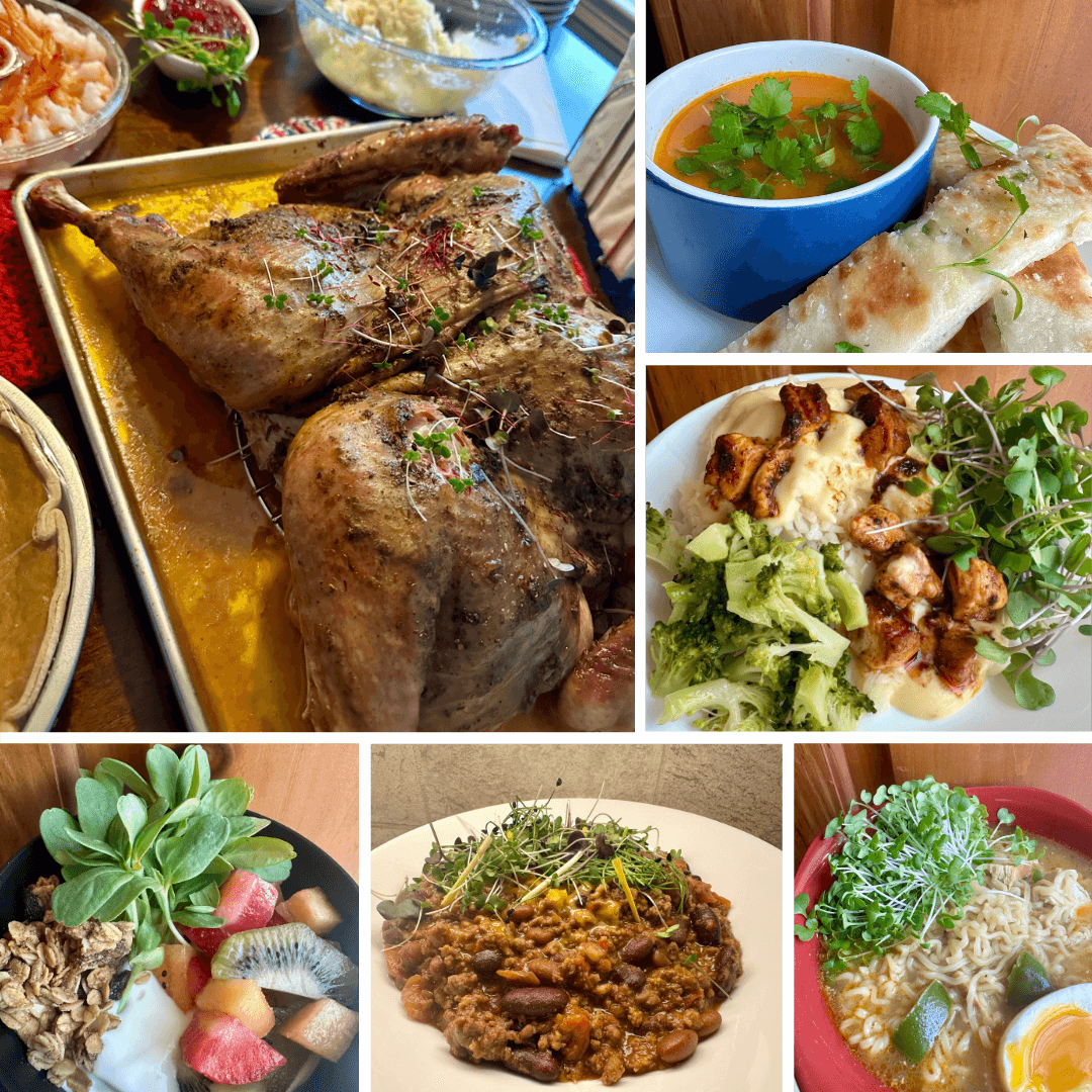 Assorted dishes including roasted meat, soup, salad, fruit platter, and a rice dish with herbs, arranged on plates and bowls.
