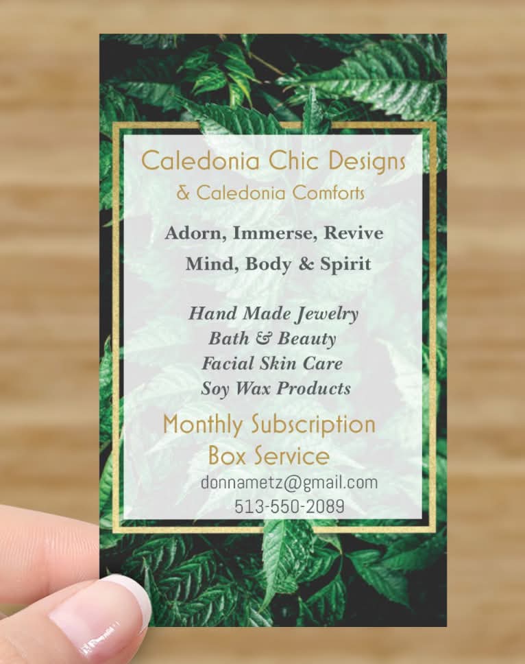 Business card with green leaf background and white text, advertising jewelry, spa, and subscription services.