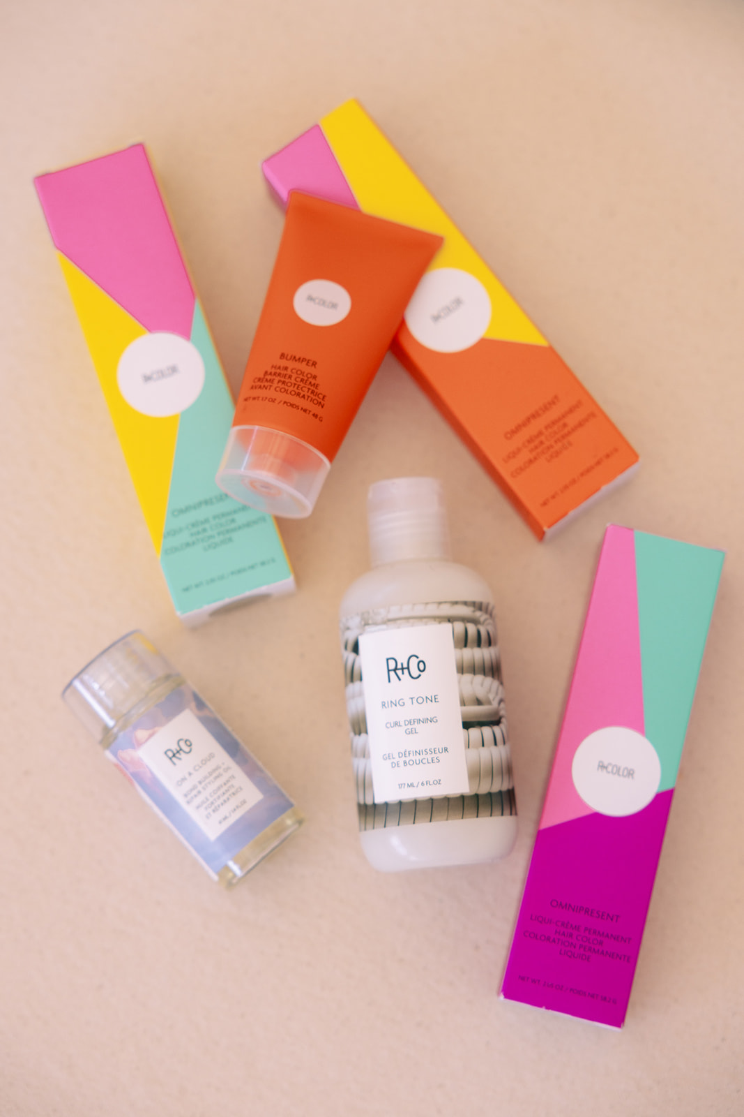 Various skincare products and colorful boxes on a light surface.