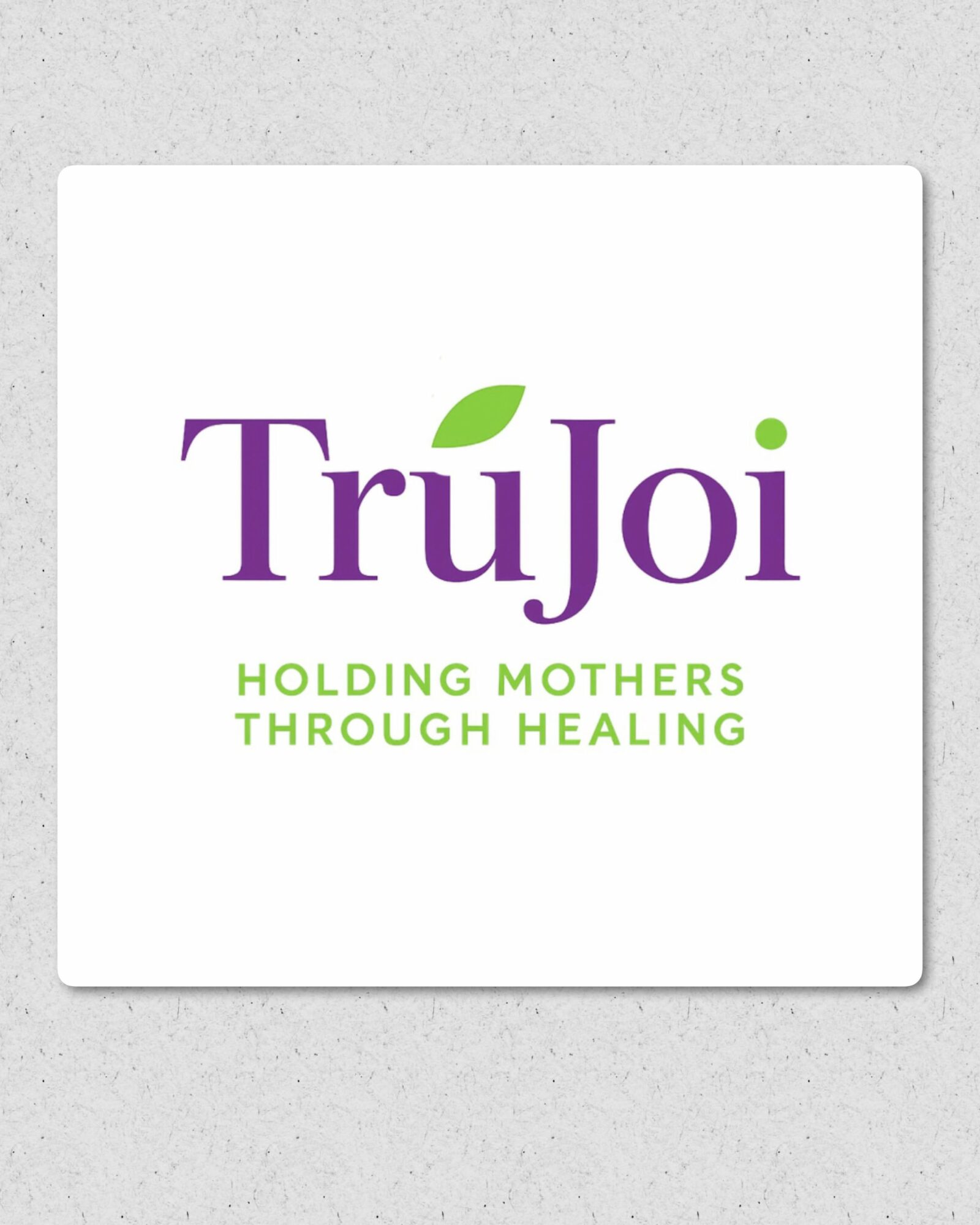 Logo with purple and green text, reading 'TruJoi' and 'Holding Mothers Through Healing', on a white background.