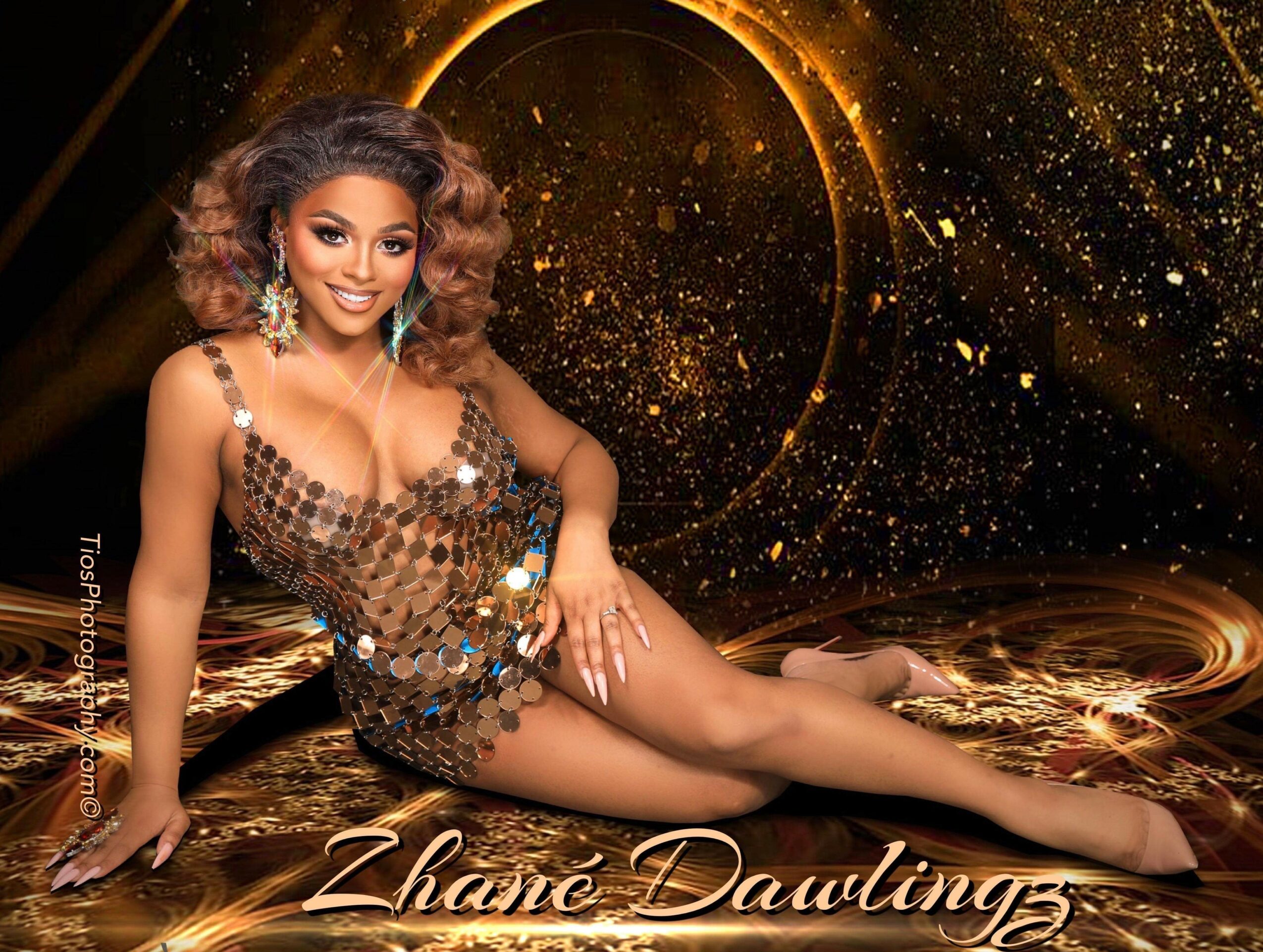 Woman in a sequined dress lying on a golden, sparkly background with a circular design, smiling, with text 'Zhane Dawlings'.